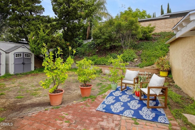view of patio with an outbuilding and a storage shed