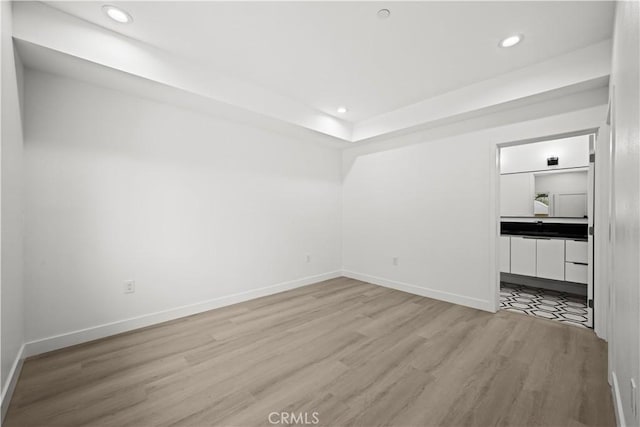 648 N Boyle Ave, Los Angeles, CA 90033 - unfurnished room featuring light wood finished floors, baseboards, and recessed lighting