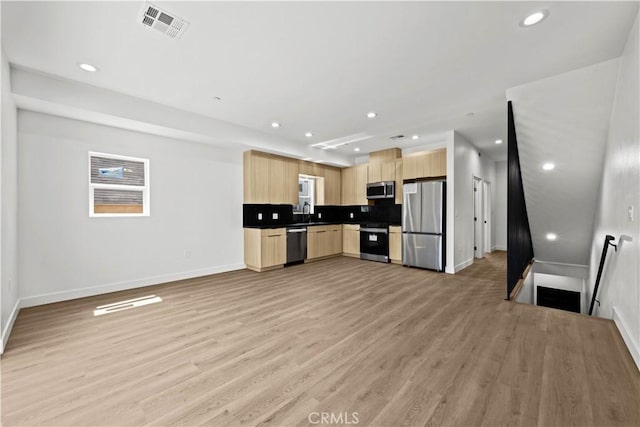 648 N Boyle Ave, Los Angeles, CA 90033 - kitchen with appliances with stainless steel finishes, visible vents, baseboards, and light brown cabinetry