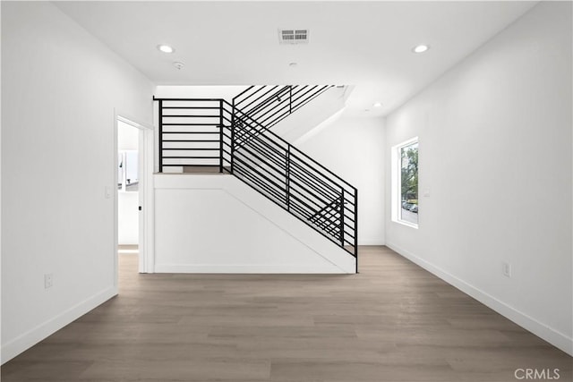 648 N Boyle Ave, Los Angeles, CA 90033 - unfurnished living room featuring stairs, wood finished floors, visible vents, and recessed lighting