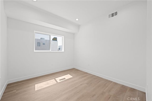 648 N Boyle Ave, Los Angeles, CA 90033 - empty room featuring visible vents, light wood-style flooring, and baseboards