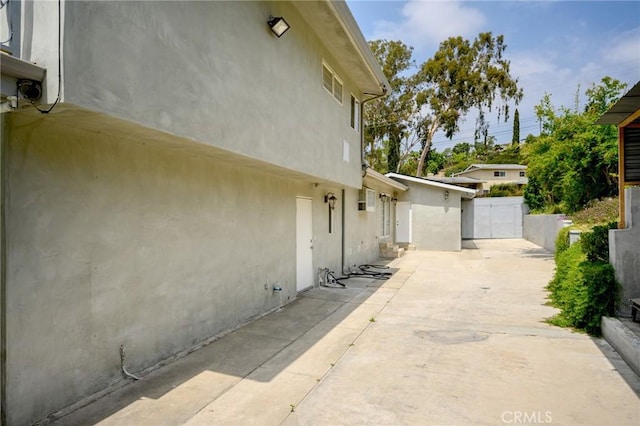 7980 Hollywood Way, Sun Valley, CA 91352 - view of side of property featuring a patio area and stucco siding