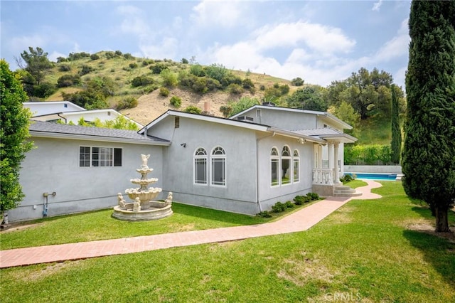 7980 Hollywood Way, Sun Valley, CA 91352 - back of property with a yard, stucco siding, and a fenced in pool