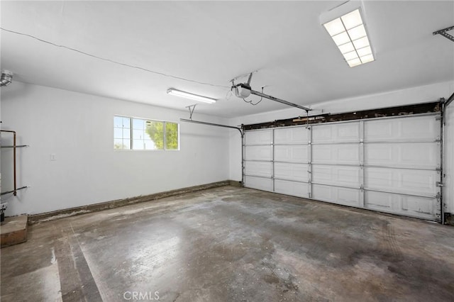 7980 Hollywood Way, Sun Valley, CA 91352 - garage with baseboards and a garage door opener