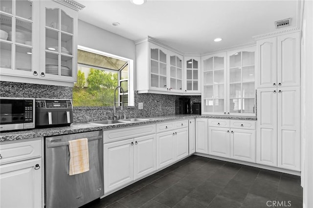 7980 Hollywood Way, Sun Valley, CA 91352 - kitchen featuring a sink, visible vents, decorative backsplash, glass insert cabinets, and appliances with stainless steel finishes
