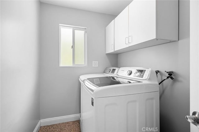 7980 Hollywood Way, Sun Valley, CA 91352 - clothes washing area featuring baseboards, washer and dryer, and cabinet space
