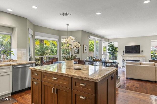 2113 Doral Ct, Oxnard, CA 93036 - kitchen featuring dark wood-style flooring, a healthy amount of sunlight, visible vents, and dishwasher