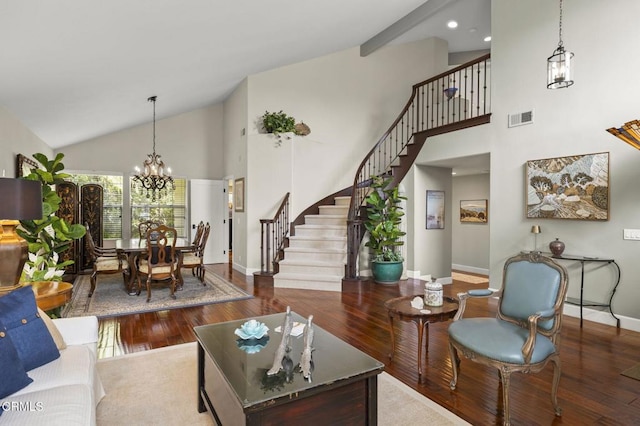 2113 Doral Ct, Oxnard, CA 93036 - living room with an inviting chandelier, visible vents, stairs, high vaulted ceiling, and wood finished floors