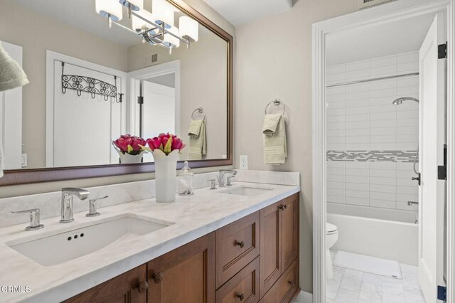 2113 Doral Ct, Oxnard, CA 93036 - full bathroom featuring a sink, double vanity, toilet, and a notable chandelier