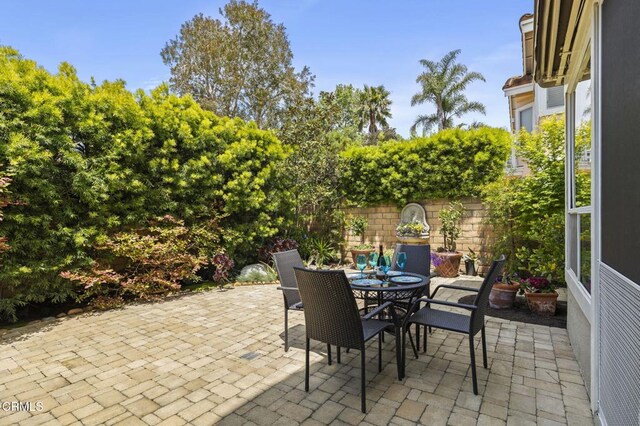 2113 Doral Ct, Oxnard, CA 93036 - view of patio featuring outdoor dining space and fence
