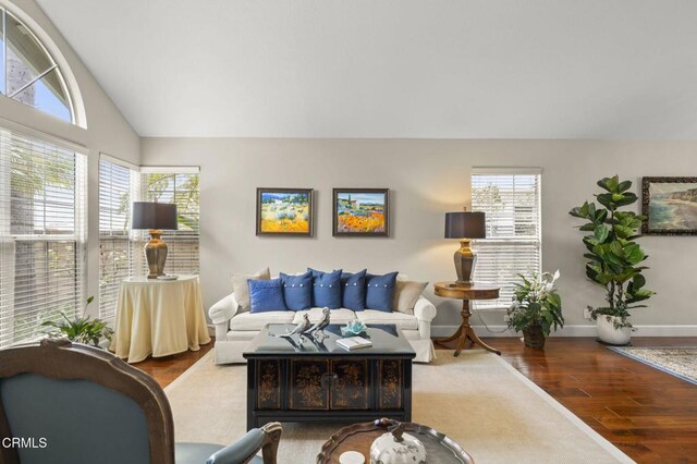 2113 Doral Ct, Oxnard, CA 93036 - living room featuring vaulted ceiling, wood finished floors, and baseboards