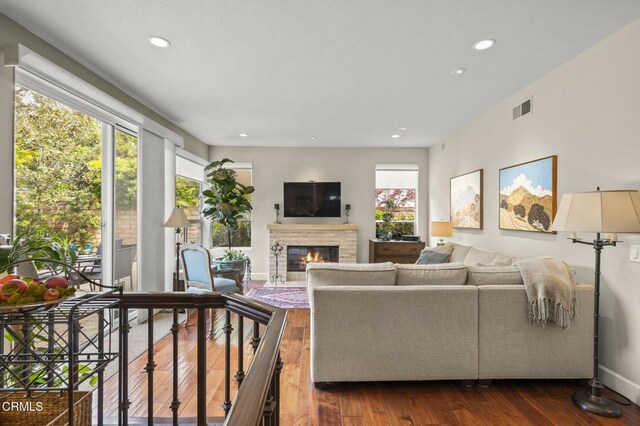 2113 Doral Ct, Oxnard, CA 93036 - living area featuring recessed lighting, visible vents, dark wood-style flooring, and a glass covered fireplace