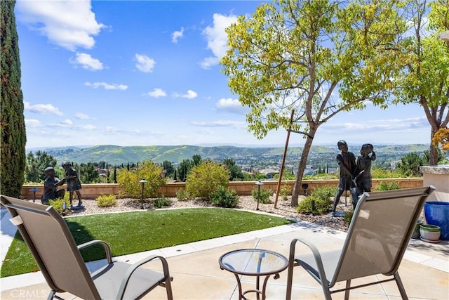 view of patio with a mountain view