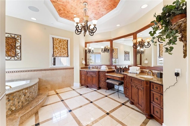 19 Fox Hole Rd, Ladera Ranch, CA 92694 - full bath with a chandelier, double vanity, a raised ceiling, a garden tub, and recessed lighting