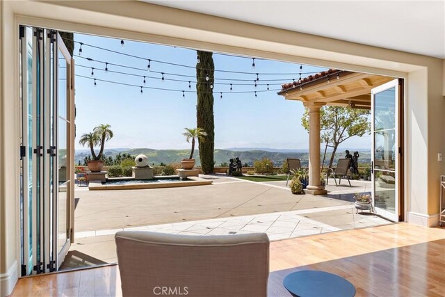19 Fox Hole Rd, Ladera Ranch, CA 92694 - doorway with a mountain view and wood finished floors