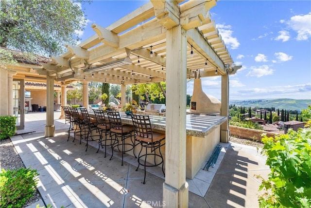19 Fox Hole Rd, Ladera Ranch, CA 92694 - view of patio / terrace with a pergola and a mountain view