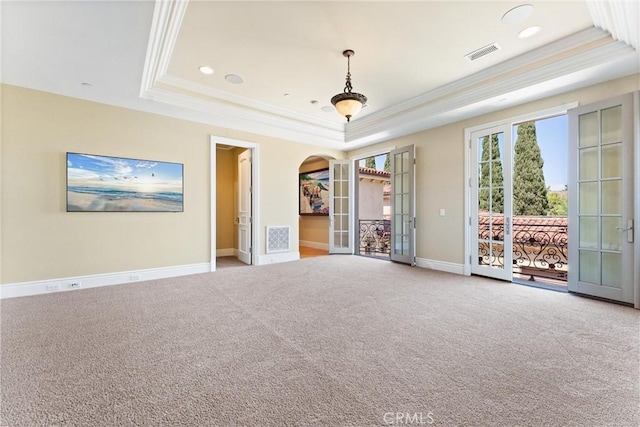 19 Fox Hole Rd, Ladera Ranch, CA 92694 - carpeted spare room featuring a raised ceiling, crown molding, french doors, arched walkways, and recessed lighting