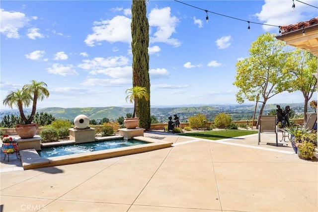 view of patio featuring a mountain view
