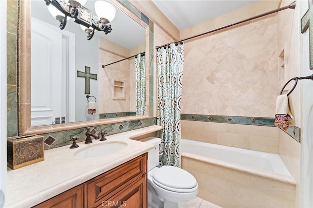bathroom featuring toilet, tile patterned floors, vanity, and shower / bath combo