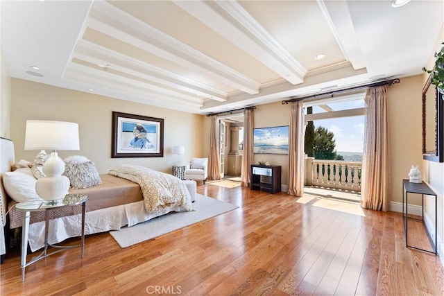 bedroom featuring access to exterior, crown molding, beamed ceiling, a raised ceiling, and light wood-style floors