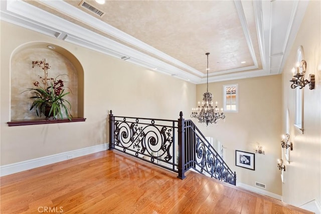 19 Fox Hole Rd, Ladera Ranch, CA 92694 - staircase with a chandelier, wood finished floors, and a tray ceiling