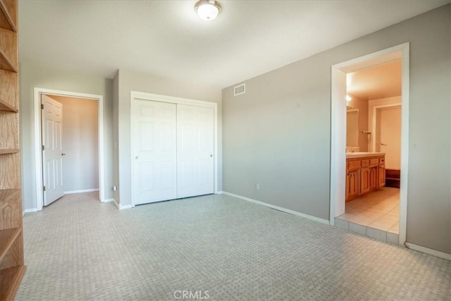 2322 Almond Springs Dr, Paso Robles, CA 93446 - unfurnished bedroom featuring light colored carpet, a closet, and baseboards