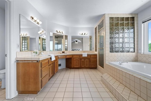 2322 Almond Springs Dr, Paso Robles, CA 93446 - bathroom with tile patterned floors, toilet, a garden tub, and vanity