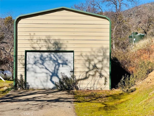 detached garage with aphalt driveway