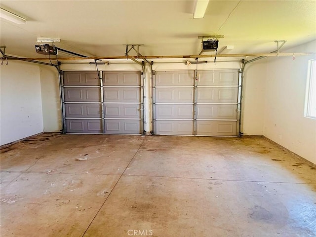 garage featuring a garage door opener