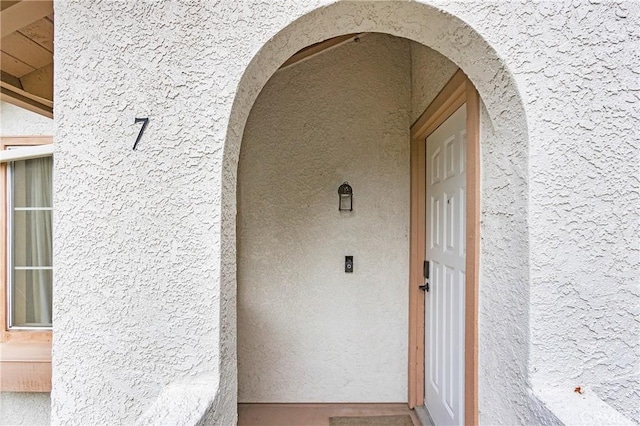26511 Merienda Unit 7, Laguna Hills, CA 92656 - view of exterior entry with stucco siding