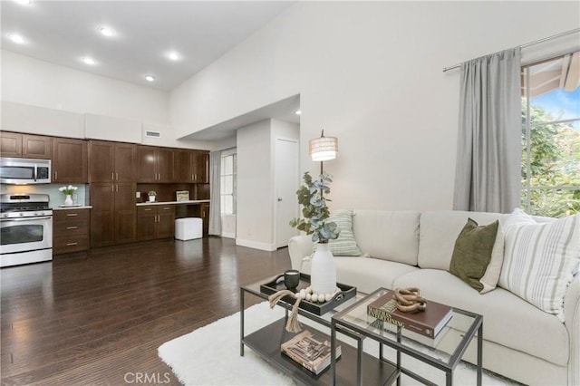 26511 Merienda Unit 7, Laguna Hills, CA 92656 - living area featuring dark wood-type flooring, a high ceiling, and recessed lighting