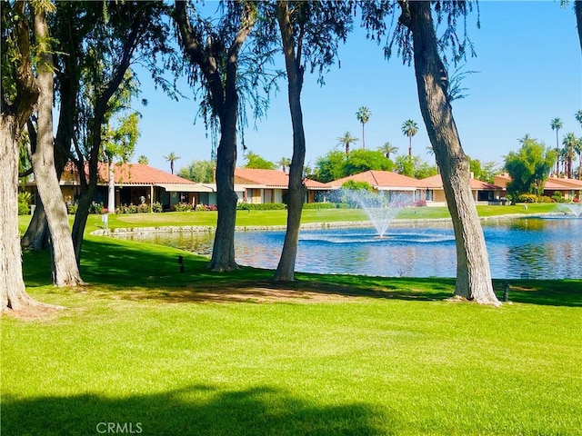 1 Valencia Dr, Rancho Mirage, CA 92270 - view of home's community with a water view and a lawn