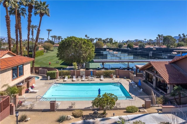 1 Valencia Dr, Rancho Mirage, CA 92270 - community pool featuring fence and a patio