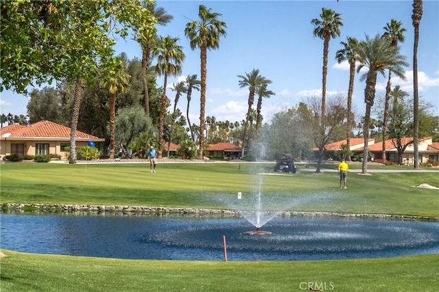 1 Valencia Dr, Rancho Mirage, CA 92270 - surrounding community with a water view, a lawn, and golf course view