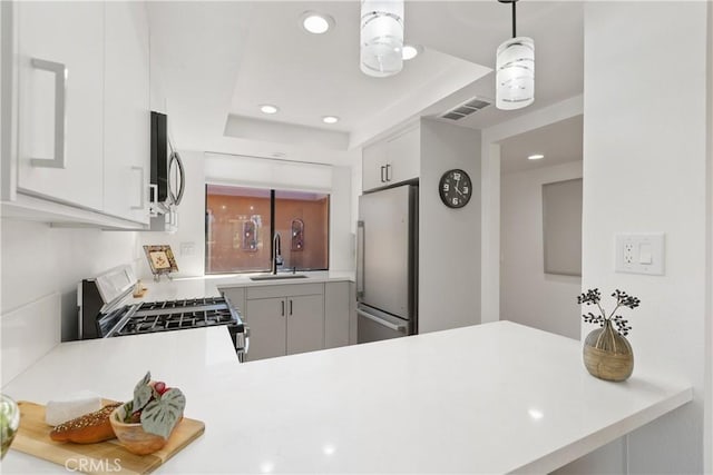 1 Valencia Dr, Rancho Mirage, CA 92270 - kitchen featuring stainless steel appliances, a sink, recessed lighting, a peninsula, and light countertops