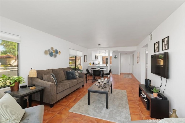 1 Valencia Dr, Rancho Mirage, CA 92270 - living area with healthy amount of natural light and light tile patterned floors