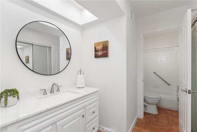 1 Valencia Dr, Rancho Mirage, CA 92270 - full bath featuring vanity, toilet, tile patterned floors, a skylight, and bathing tub / shower combination