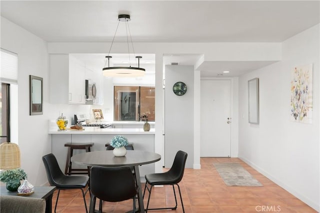 1 Valencia Dr, Rancho Mirage, CA 92270 - dining room featuring baseboards