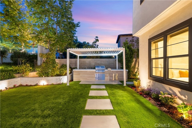 100 Bellatrix, Irvine, CA 92618 - yard at dusk featuring area for grilling, a patio area, and a fenced backyard