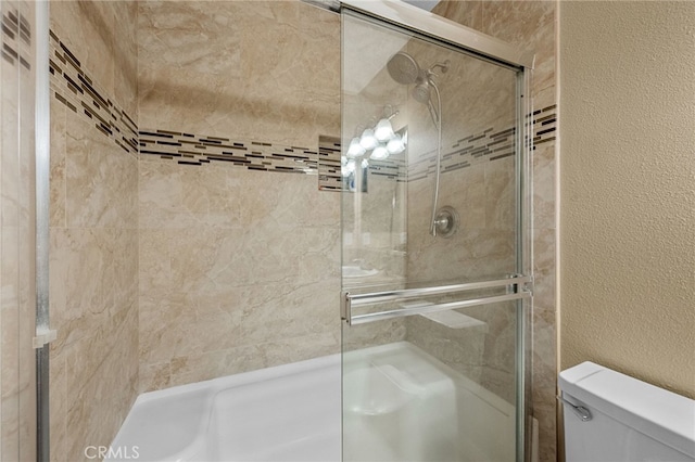 23412 Pacific Park Dr Unit 40H, Aliso Viejo, CA 92656 - full bathroom featuring a shower stall, toilet, and a textured wall