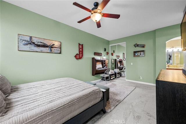 23412 Pacific Park Dr Unit 40H, Aliso Viejo, CA 92656 - bedroom featuring carpet flooring, arched walkways, a ceiling fan, and baseboards