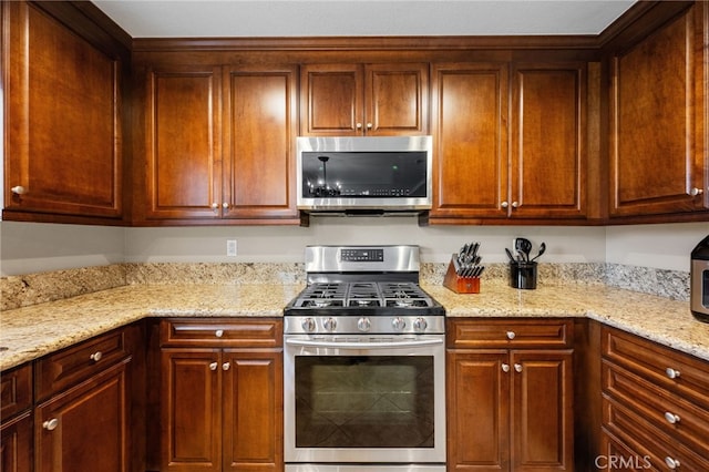 23412 Pacific Park Dr Unit 40H, Aliso Viejo, CA 92656 - kitchen with stainless steel appliances and light stone countertops