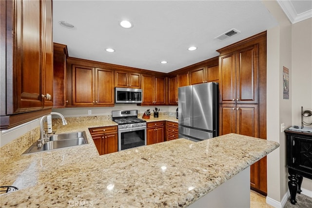 23412 Pacific Park Dr Unit 40H, Aliso Viejo, CA 92656 - kitchen featuring appliances with stainless steel finishes, a sink, recessed lighting, light stone countertops, and a peninsula
