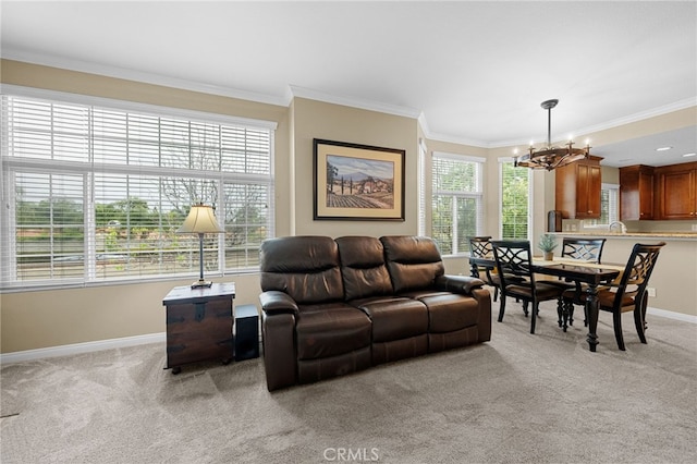 23412 Pacific Park Dr Unit 40H, Aliso Viejo, CA 92656 - living room featuring light carpet, a chandelier, ornamental molding, and baseboards