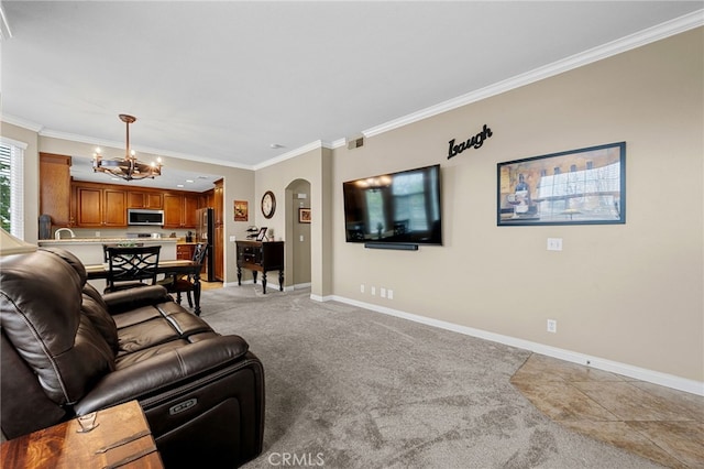 23412 Pacific Park Dr Unit 40H, Aliso Viejo, CA 92656 - living room with a chandelier, arched walkways, ornamental molding, baseboards, and light colored carpet