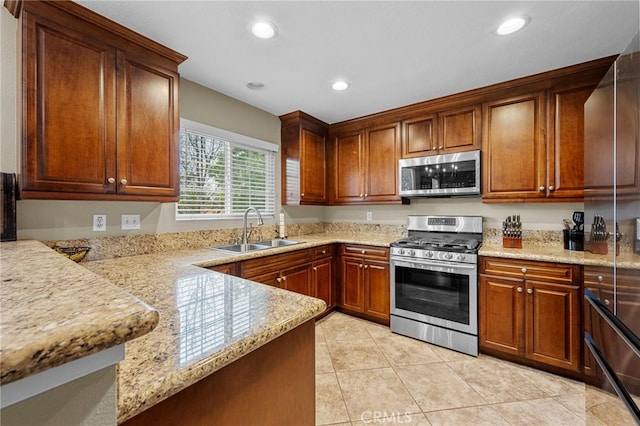 23412 Pacific Park Dr Unit 40H, Aliso Viejo, CA 92656 - kitchen featuring stainless steel appliances, a sink, recessed lighting, light tile patterned flooring, and a peninsula