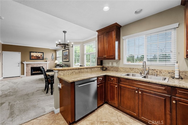 23412 Pacific Park Dr Unit 40H, Aliso Viejo, CA 92656 - kitchen featuring stainless steel dishwasher, a sink, crown molding, a premium fireplace, and a chandelier