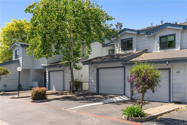 2220 Exposition Dr Unit 64, San Luis Obispo, CA 93401 - view of property featuring an attached garage and driveway