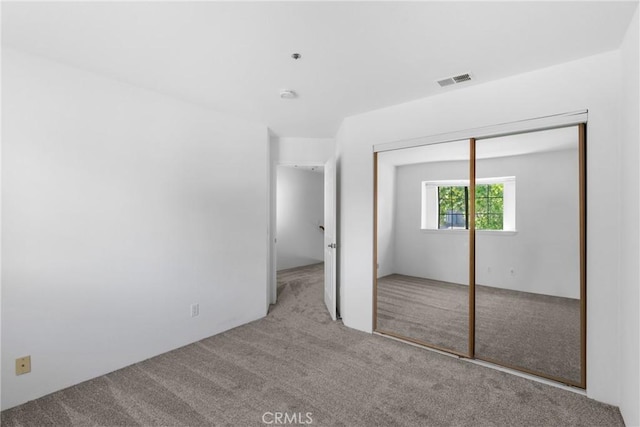 2220 Exposition Dr Unit 64, San Luis Obispo, CA 93401 - unfurnished bedroom featuring carpet floors and a closet