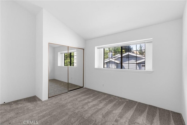 2220 Exposition Dr Unit 64, San Luis Obispo, CA 93401 - unfurnished bedroom with carpet flooring, vaulted ceiling, and a closet